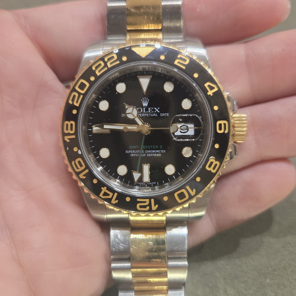 Rolex GMT-Master II Black and Gold Watch 116713